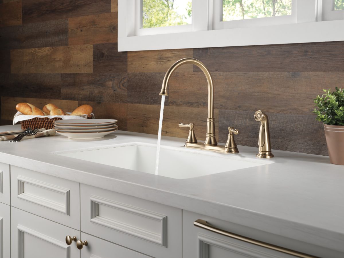 DELTA Cassidy Two Handle Kitchen Faucet with Spray — Champagne Bronze