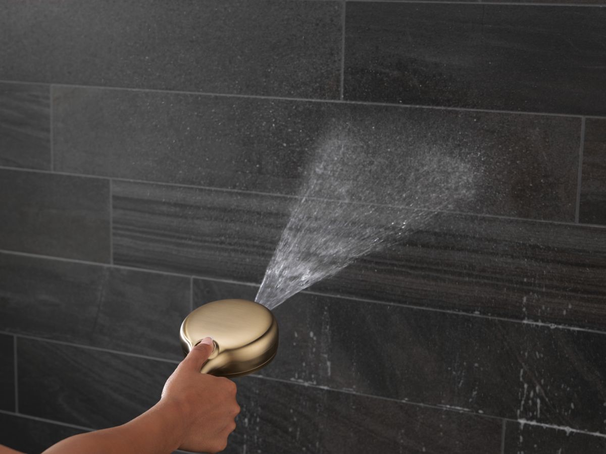 DELTA Universal Showering Components 7-Setting Wall Mount Hand Shower with Cleaning Spray — Lumicoat® Champagne Bronze