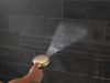 DELTA Universal Showering Components 7-Setting Wall Mount Hand Shower with Cleaning Spray — Lumicoat® Champagne Bronze