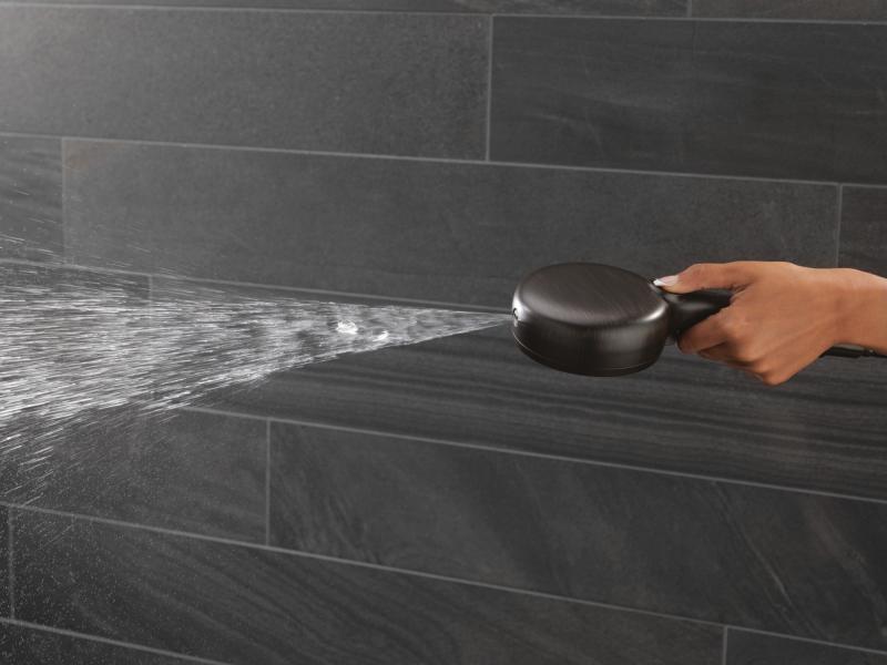 DELTA Universal Showering Components 7-Setting Wall Mount Hand Shower with Cleaning Spray — Venetian Bronze