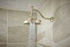 BRIZO Invari 7 5/8” H2Okinetic Round Multi-Function Shower Head - 2.5 GPM — Polished Nickel