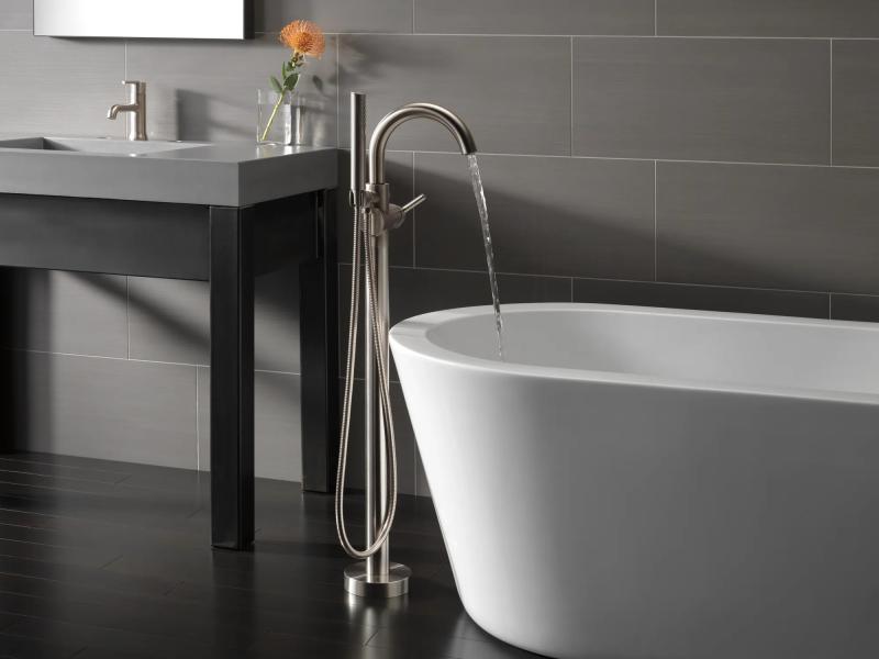 DELTA Trinsic Single Handle Floor Mount Tub Filler Trim with Hand Shower — Stainless