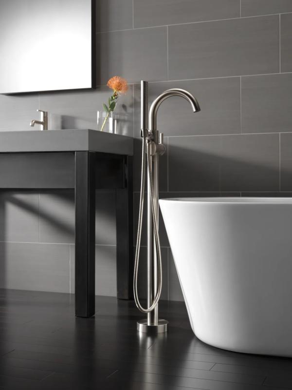 DELTA Trinsic Single Handle Floor Mount Tub Filler Trim with Hand Shower — Stainless