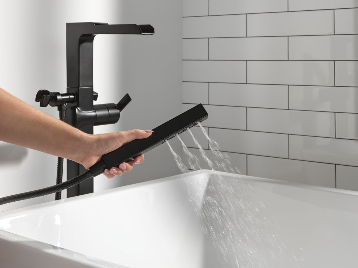 DELTA Ara Single Handle Floor Mount Channel Spout Tub Filler Trim with Hand Shower — Matte Black
