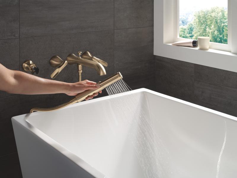 DELTA Bonacci Two Handle Wall Mount Tub Filler Trim with Hand Shower — Lumicoat® Champagne Bronze